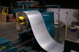 Steel coil being removed from the press